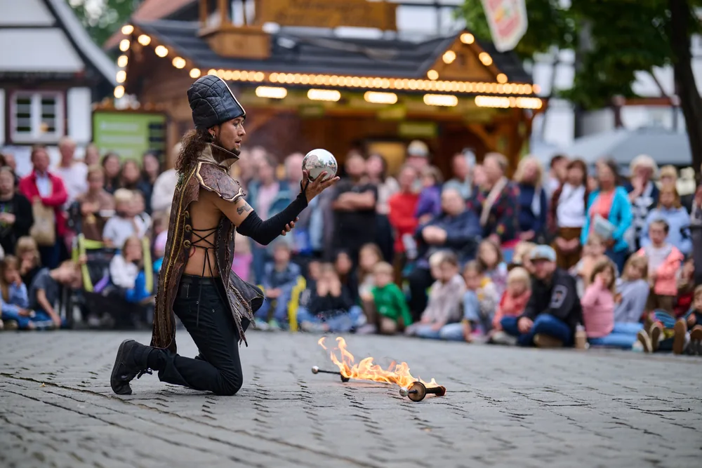 Dario with a crystal ball in front of an audience