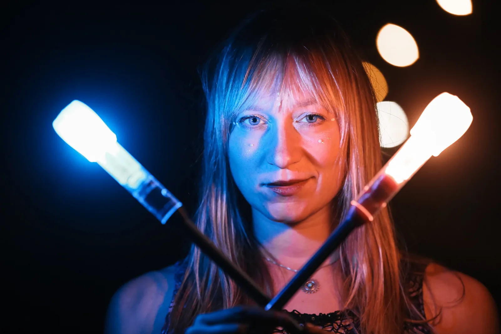 Portrait with glowing LED clubs