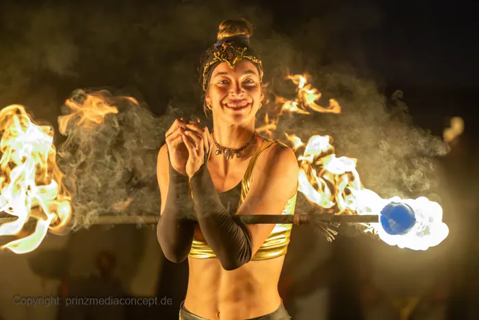Mascha surrounded by fire and smoke