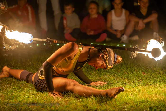 Mascha performing close to the ground with fire