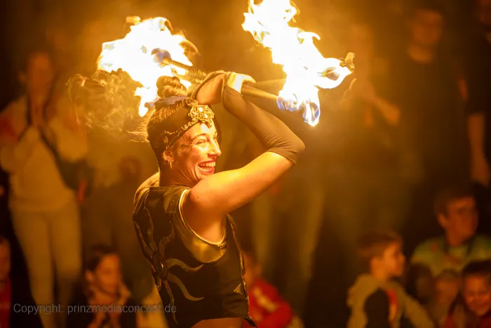 Mascha performing with fire in front of the audience