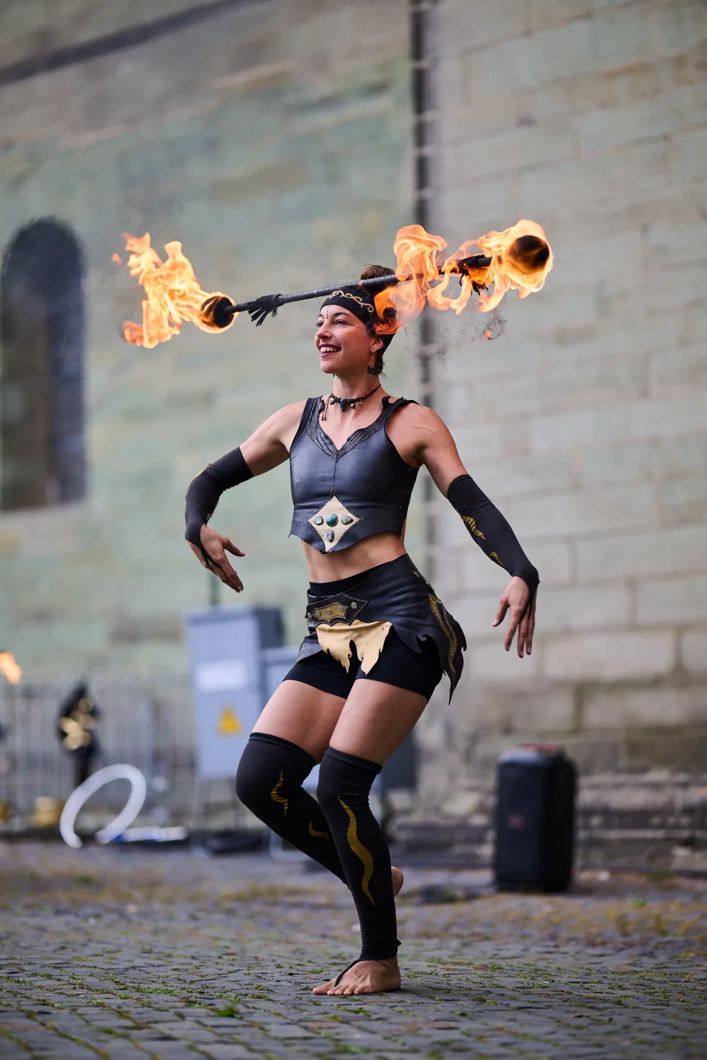 Mascha performing with fire in a town square