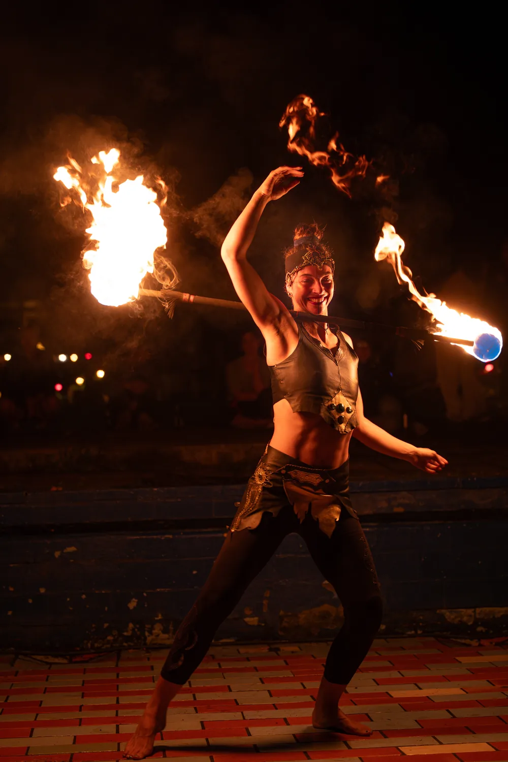 Mascha spinning fire at night